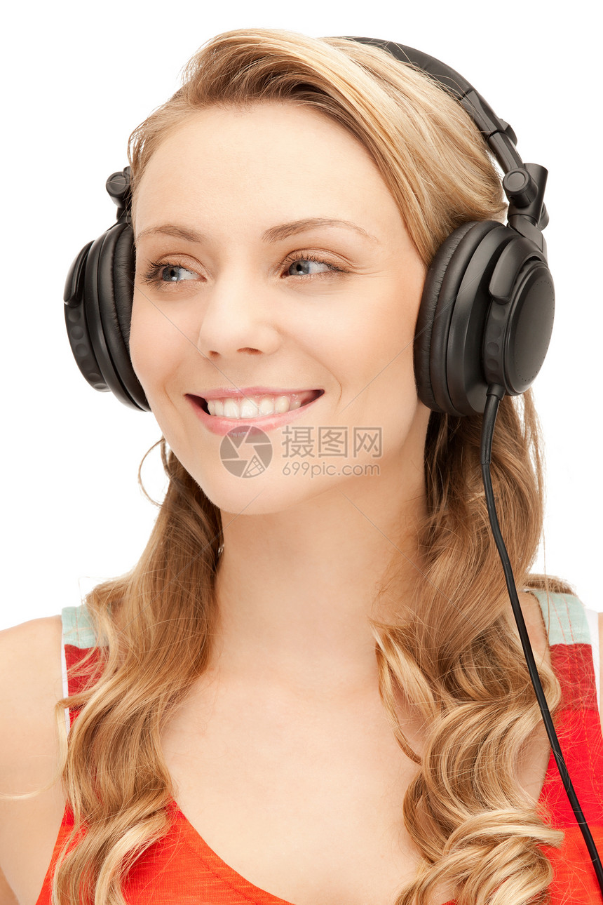 使用大耳机的快乐少女喜悦听力幸福乐趣女孩闲暇青少年音乐耳机享受图片