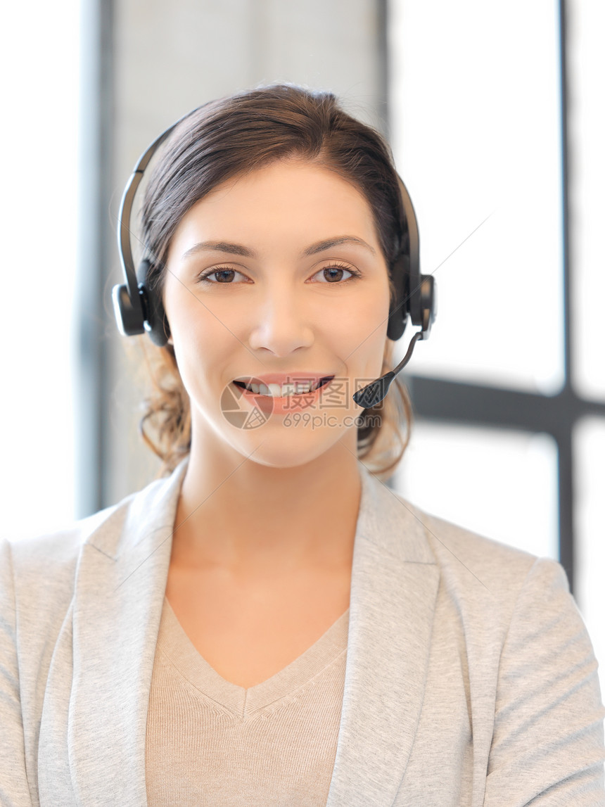 帮助热线女性求助快乐秘书服务台微笑工人代理人耳机手机图片