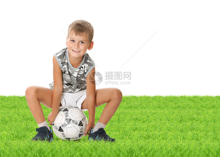 男孩足球球手快乐竞赛乐趣运动运动员童年闲暇冠军幸福草皮图片