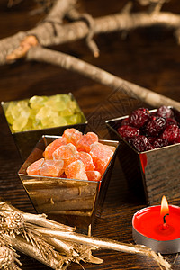 圣诞食季节性李子蜡烛橙子食物背景图片
