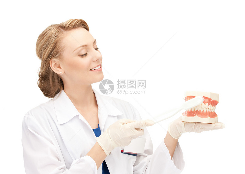 有牙刷和下巴的有吸引力的女医生治疗卫生药品微笑牙科专家女性女士假牙牙医图片