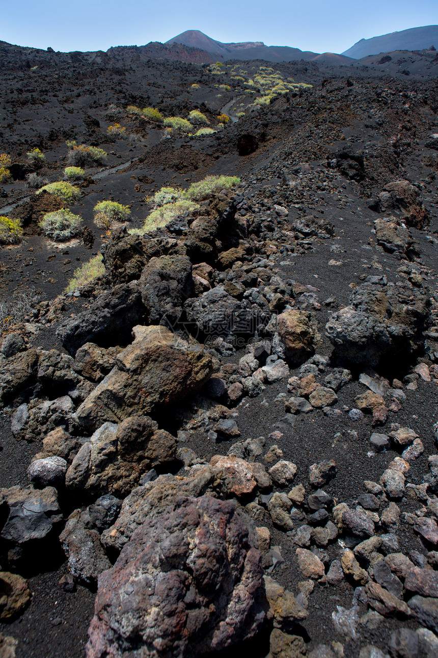拉帕尔马火山熔岩黑石晴天沙漠石头土壤天空土地观光火山旅行岩石图片