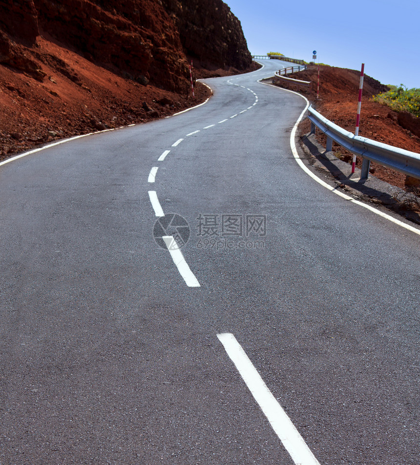 加那利群岛山上弯曲道路曲线干旱旅游国家岛屿晴天土地石头岩石土壤假期图片