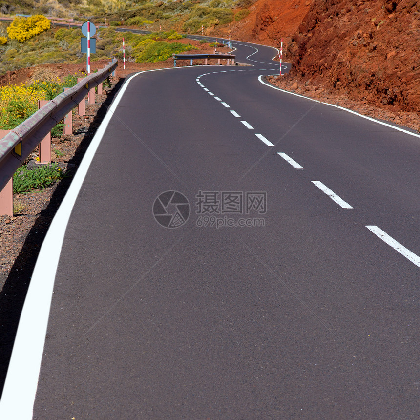 加那利群岛山上弯曲道路曲线旅行晴天土壤假期观光缠绕国家干旱旅游岩石图片