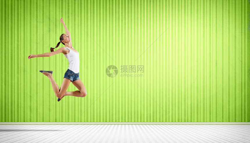 年轻女子跳舞跳跃艺术女孩健身房行动成人杂技有氧运动灵活性体操女性图片