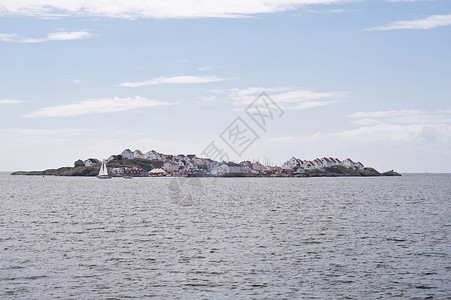 斯凯里岛的夏天瑞典阿斯托尔建筑学渔船蓝色钓鱼帆船旅行岛屿牧歌天空海岸背景