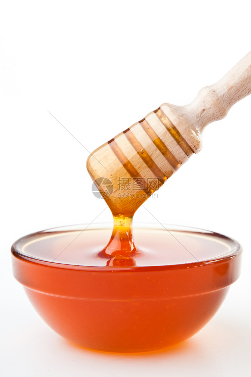 蜂蜜碗顶上的蜂蜜图片