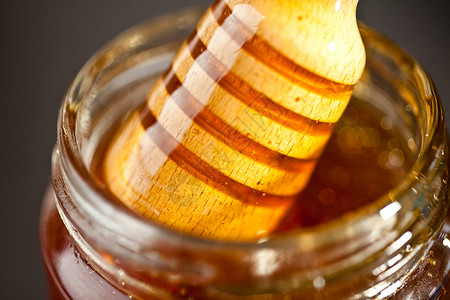 蜂蜜出罐子背景图片