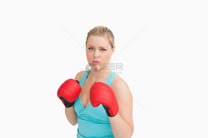戴手套的妇女浅色蓝色金发女郎竞赛运动服金发斗争头发专注冲孔图片