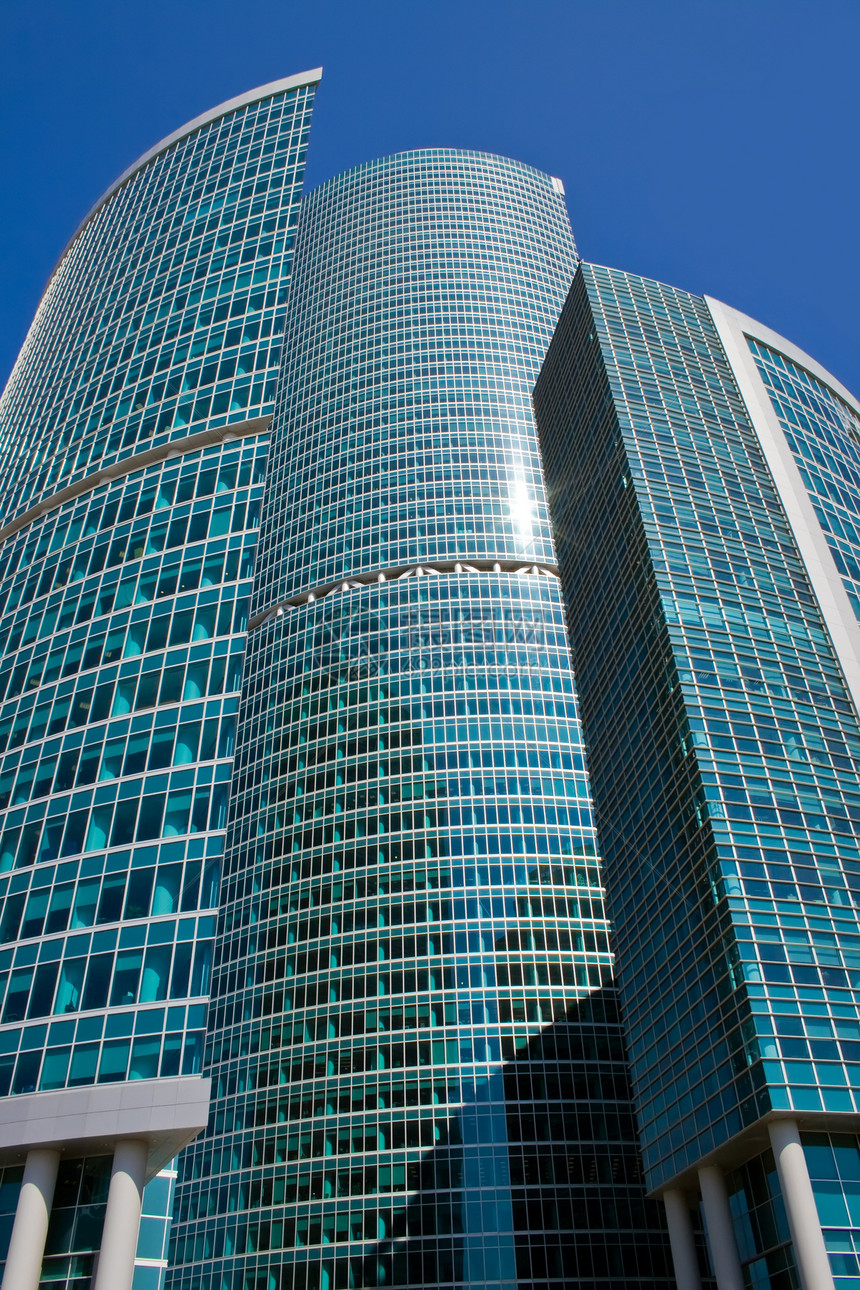 商业摩天大楼晴天蓝色太阳建造玻璃窗户财产民众总部中心图片