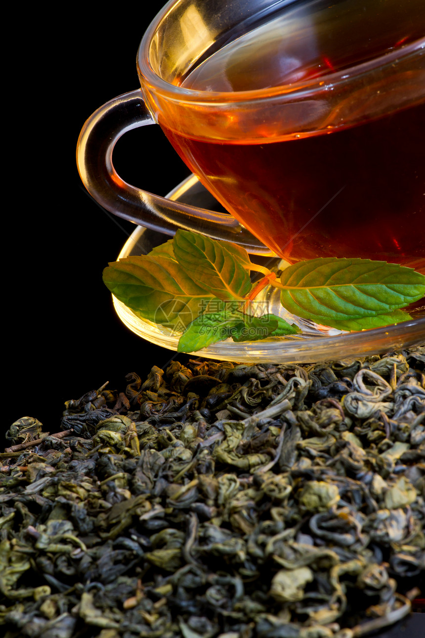 茶叶和薄荷庄稼金子商业杯子文化草药厨房黑色咖啡杯叶子图片