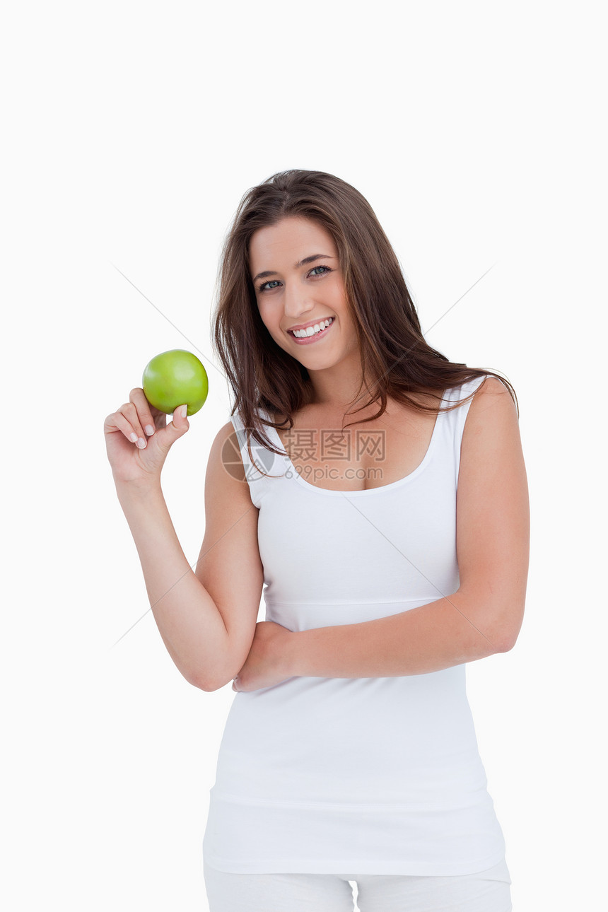 带着绿苹果的黑发女人微笑图片
