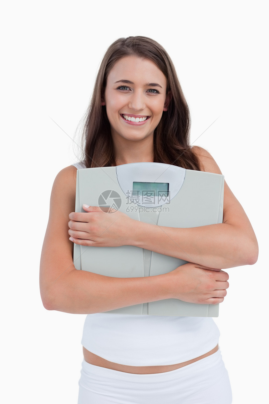 手称称称的笑女微笑外表重量体重秤快乐内衣影棚女性图片