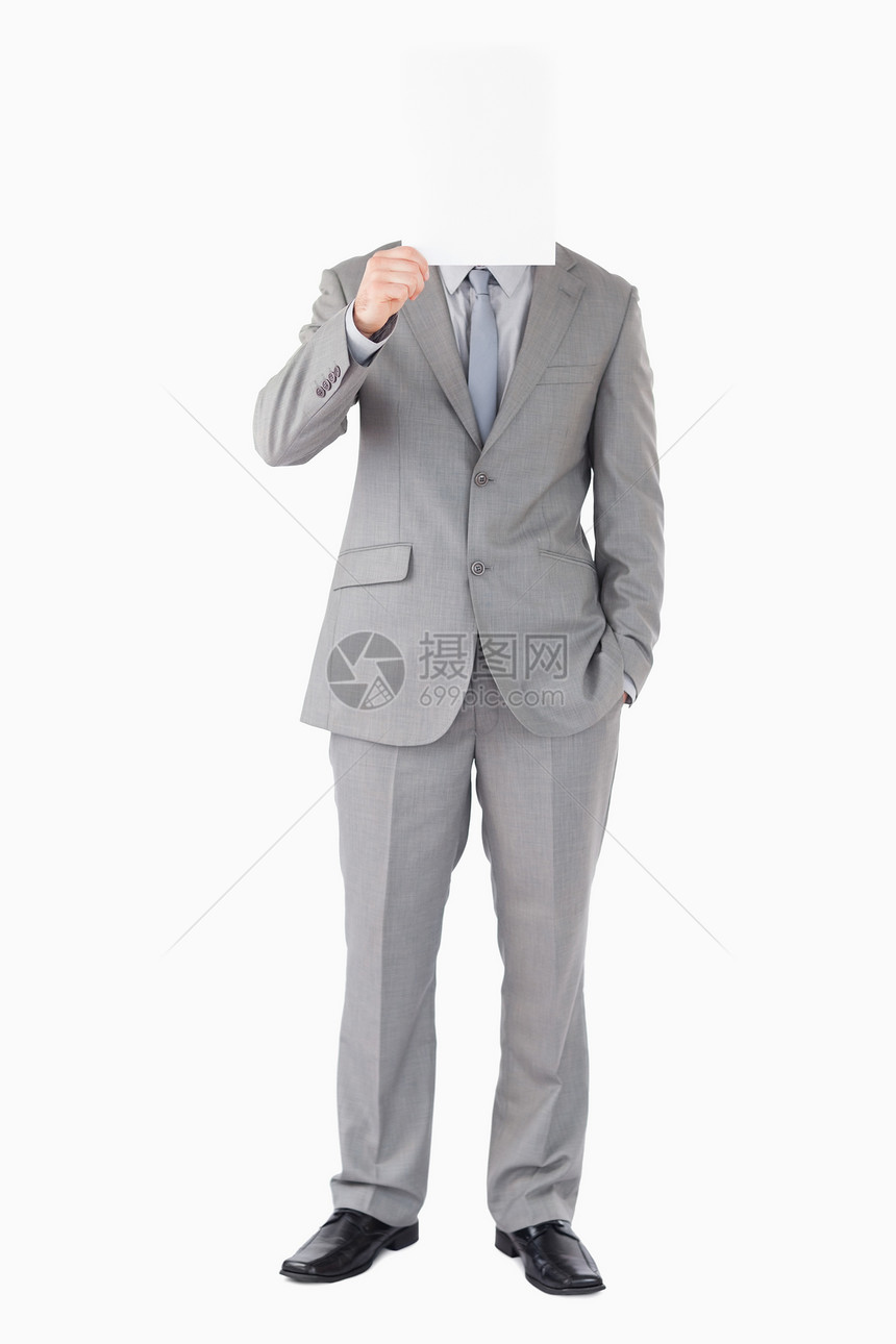 一个商务人士的肖像 在他面前拿着一张空白面板图片