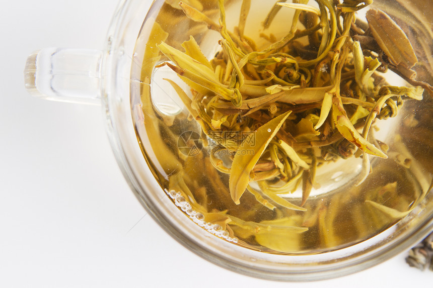 在玻璃茶壶中清茶花瓣绿色饮料仪式叶子早餐草本图片