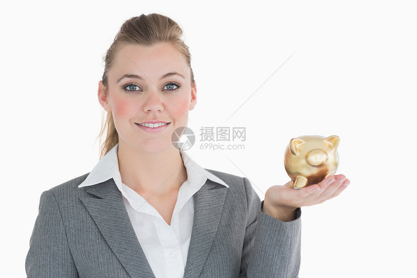 拥有小猪银行的女商务人士套装女士人士浅色储蓄商务管理人员存钱罐头发金子图片