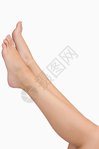 妇女伸展的双腿护理小牛赤脚肌腱身体膝盖脚趾拉伸高清图片