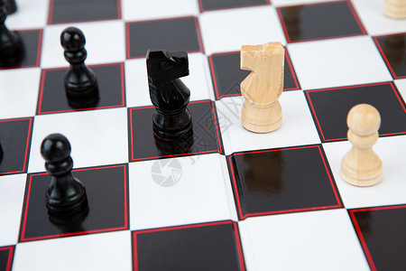 棋盘游戏正方形黑色骑士棋子典当闲暇白色战略战术背景图片