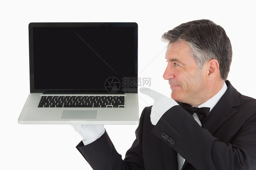 指笔记本电脑的服务员图片