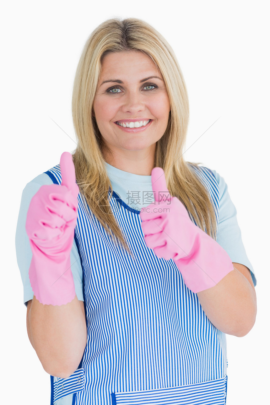 用粉色手套把拇拇指放在更清洁的地方图片