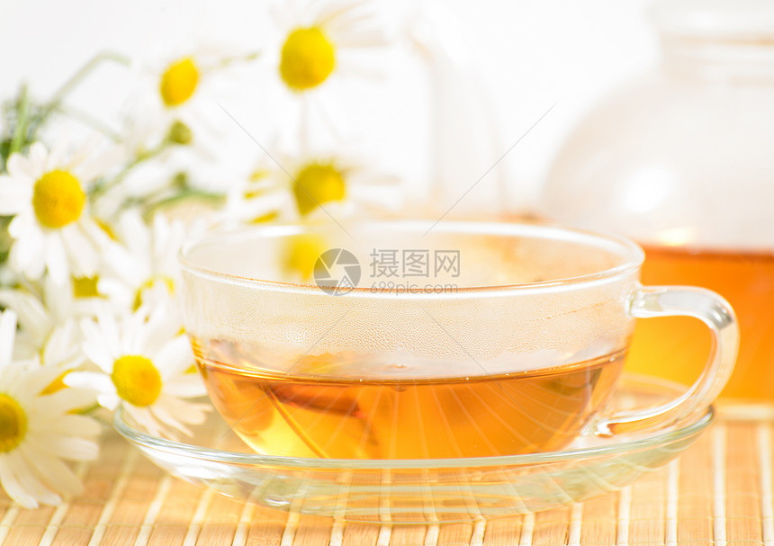 茶杯加香草甘菊茶杯子叶子液体礼物植物保健服务甘菊橙子时间图片