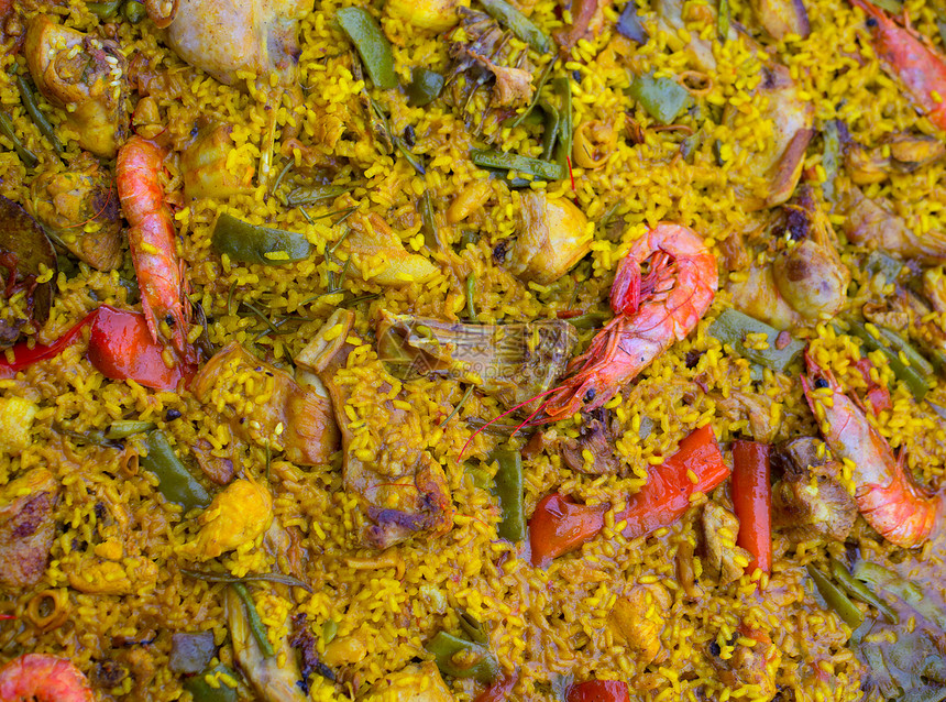 混合肉类和海产食品的西班牙大米宏观调味品香料胡椒豆子美食食谱海鲜饭平底锅厨房图片