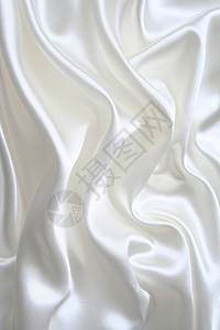 平滑优雅的白色丝绸海浪银色织物投标折痕纺织品涟漪材料曲线反光背景图片