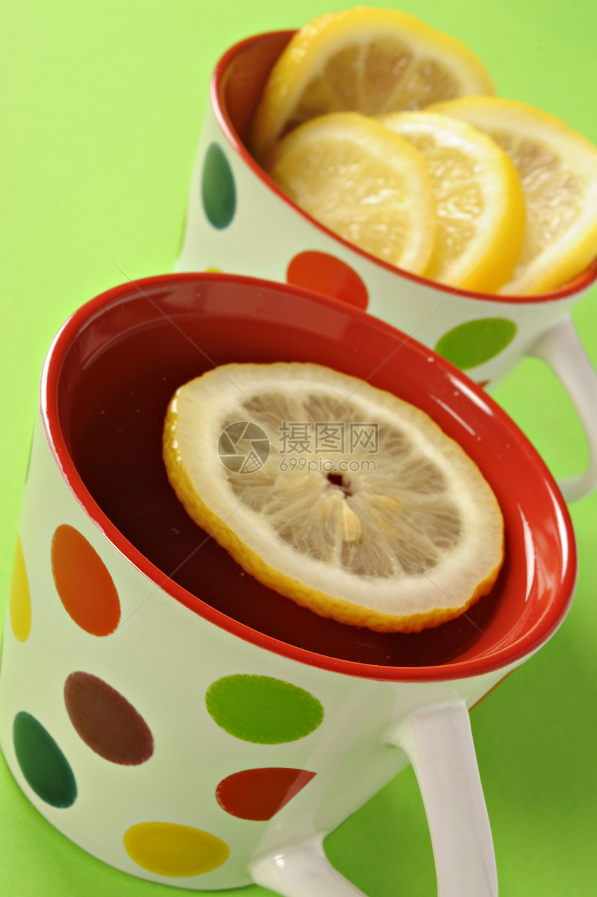 Polka点杯茶加柠檬药品水果茶点饮食热茶圆点杯子草药营养味道图片