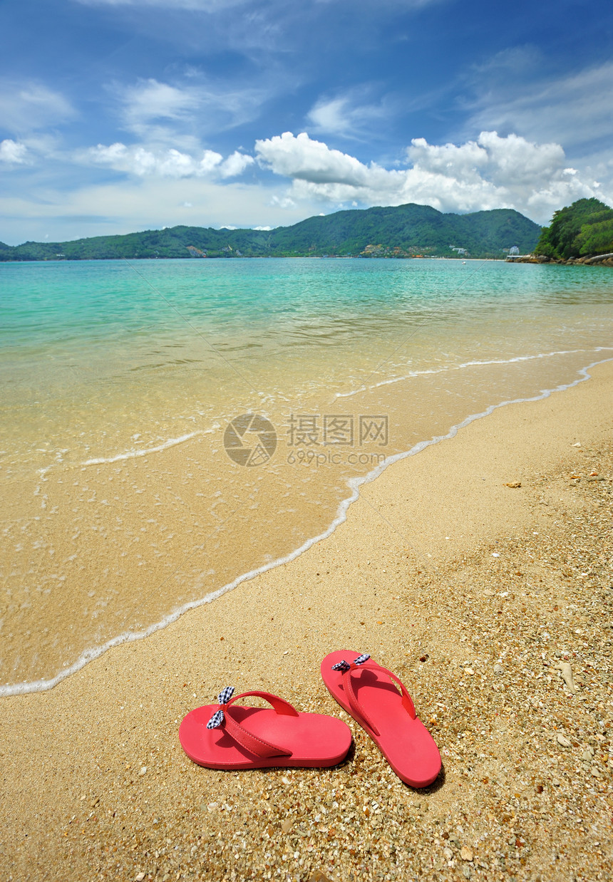 海滩翻滚式拖鞋热带游客天空假期旅行海景地平线海岸线海洋图片