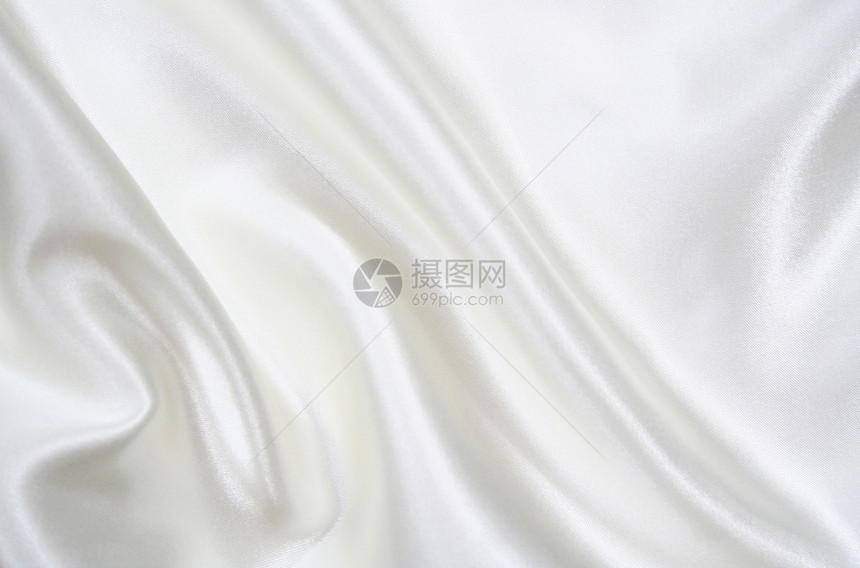 平滑优雅的白色丝绸作为背景婚礼衣服材料奢华投标纺织品海浪布料新娘涟漪图片