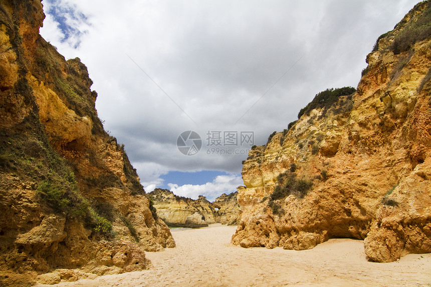 极好葡萄牙海滩白色海岸海岸线多云黄色岩石支撑风景假期图片