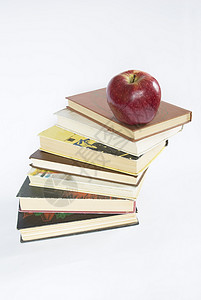 堆叠的书本教育营养水果红色图书学习背景图片