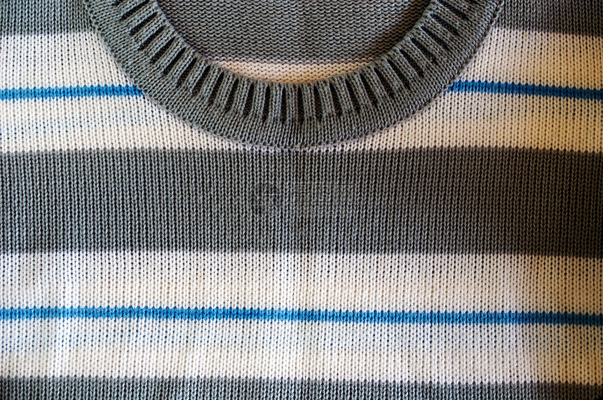 Knit 羊毛滑轮纹理颈洞背景材料纺织品手工衣服装饰服装风格蓝色套衫棉布图片