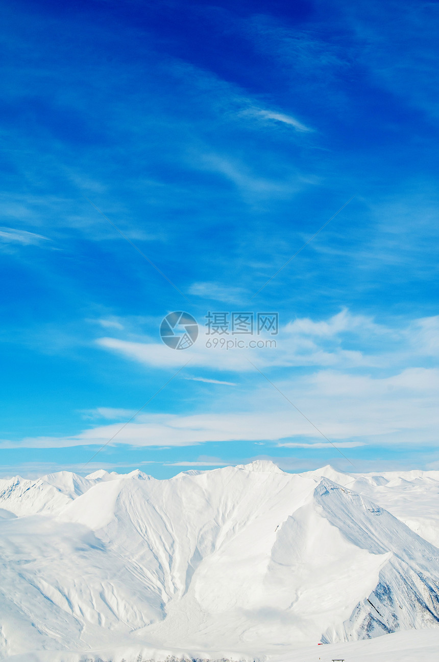 明亮的冬天天雪山白色旅行天空假期阳光冰川滑雪山脉风景场景图片