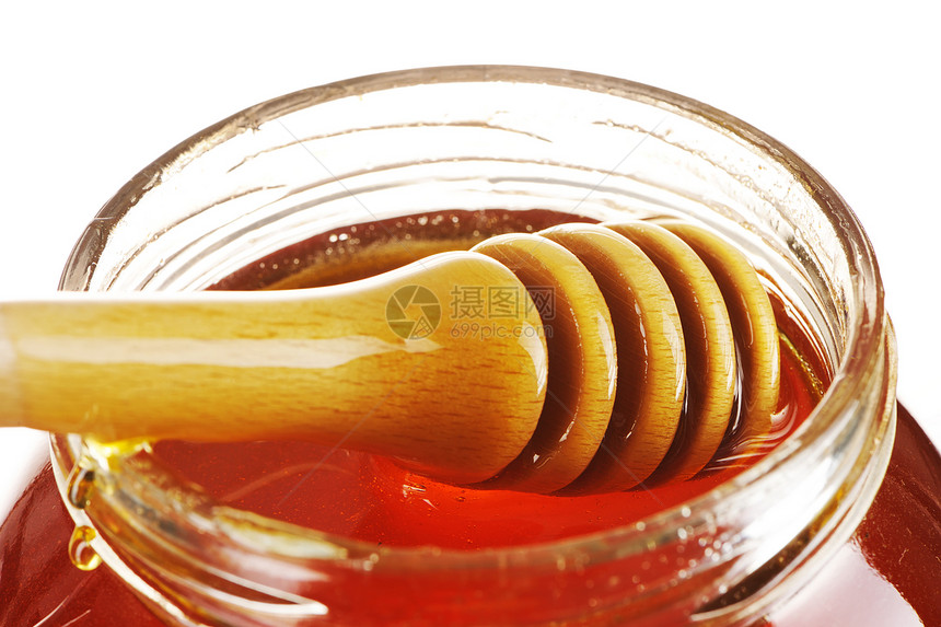 蜂蜜和甜点的罐子黄色食物金子白色玻璃液体木头图片