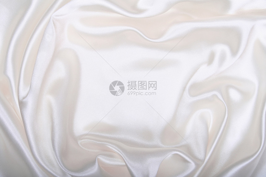 平滑优雅的白色丝绸涟漪折痕曲线婚礼投标衣服材料纺织品新娘版税图片