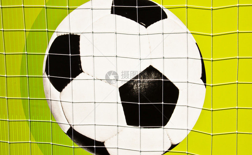 墙上的足球球爱好曲线活动游戏绿色皮革闲暇白色休闲乐趣图片