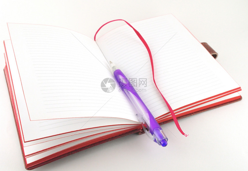 笔记本和紫花笔紫色红色打印想像力学习棕色照片日记写作条纹图片