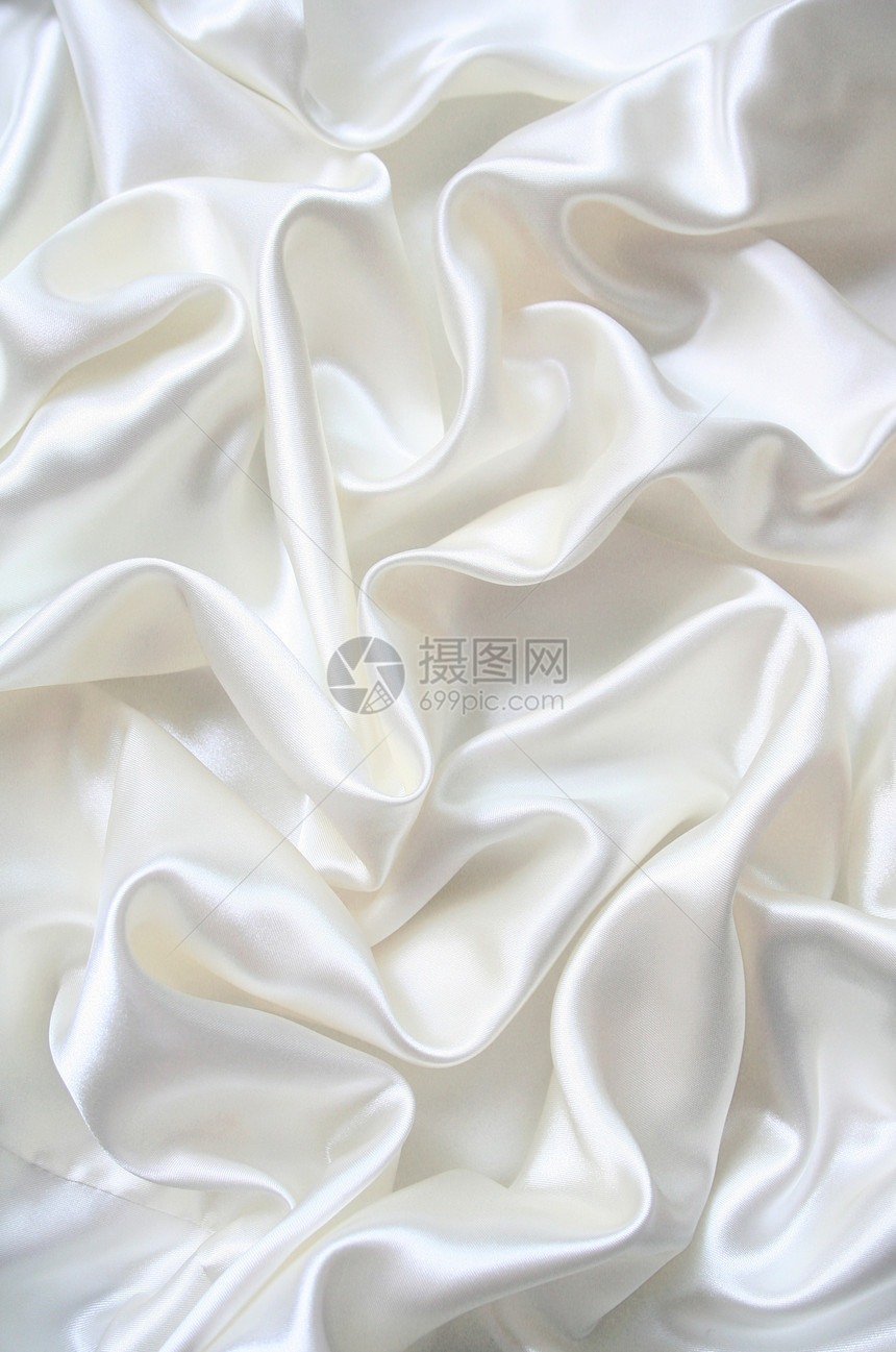 平滑 优雅的白色丝绸可用作婚礼背景新娘折痕海浪涟漪银色布料投标曲线材料织物图片