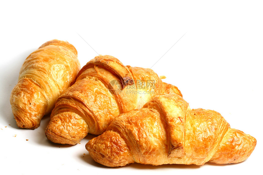 Croissunt 孔滴糕点羊角阴影美食白色小吃食物早餐面包黄油图片