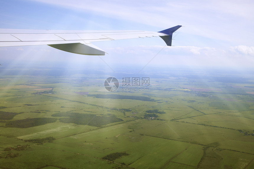 从飞机上查看喷射运输太阳光线高度天空航空航班天线旅游阴霾图片