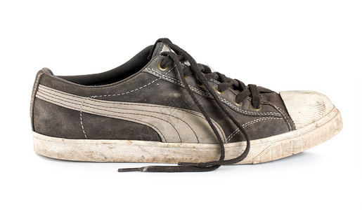 孤立的旧运动鞋背景图片