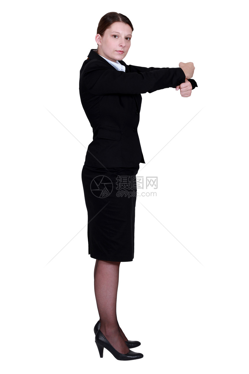 女性商业界人士用拳头做手势图片