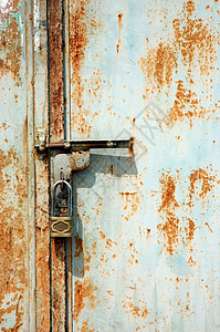 一个生锈门一个锁锁锁门的锁锁 铁生锈背景