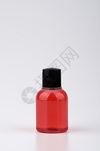 红色洗发水瓶背景图片