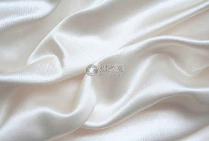 平滑优雅的白色丝绸作为背景曲线婚礼衣服布料版税投标材料海浪纺织品折痕图片