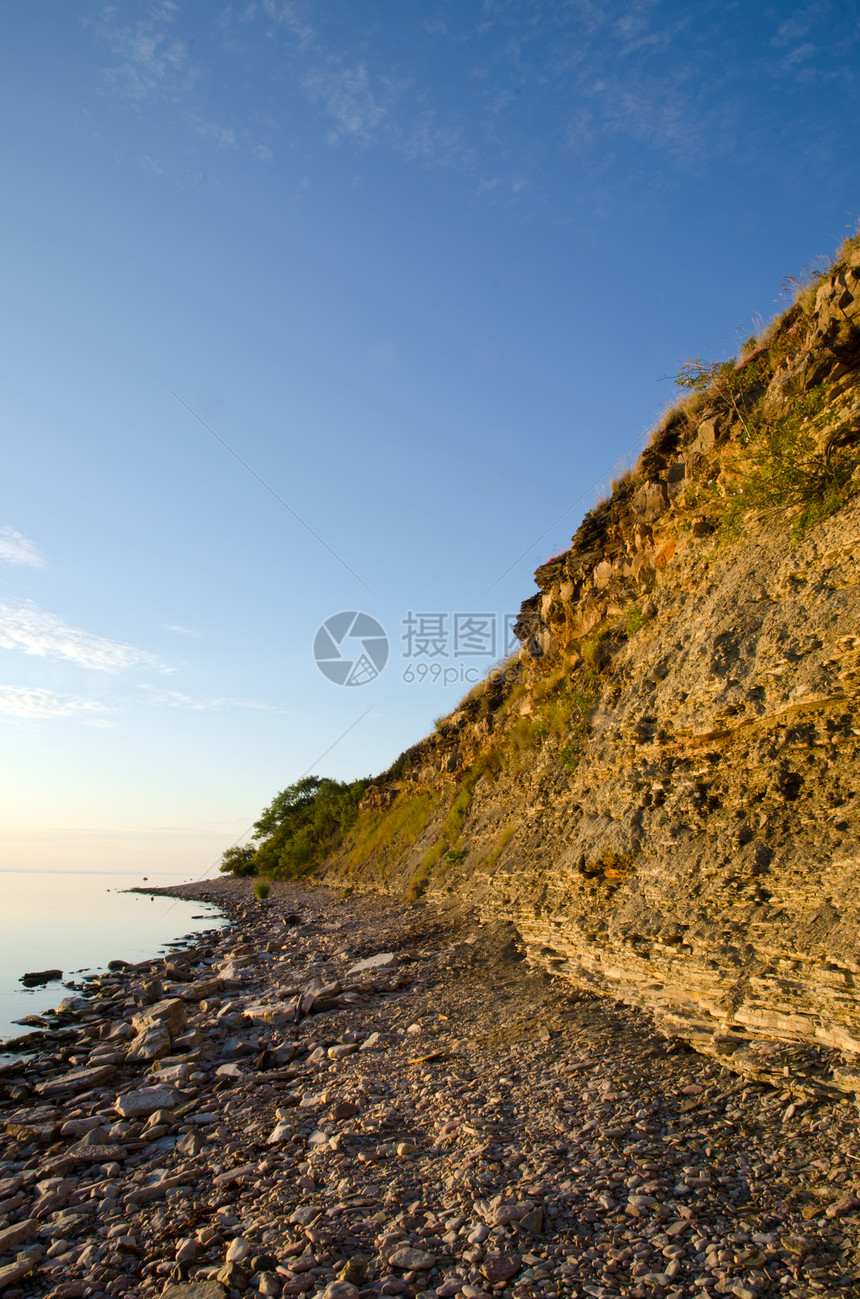 太阳悬崖风景反射蓝色旅游海岸线环境灯光假期镜子石头图片