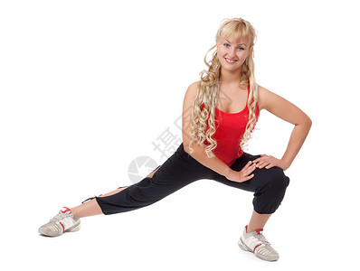 xo型腿美丽的年轻金发美女正在健身中 展示F型背景