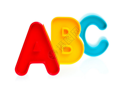 塑性塑料字母ABC数字婴儿拼写幼儿园童年学校玩具游戏黄色英语背景图片