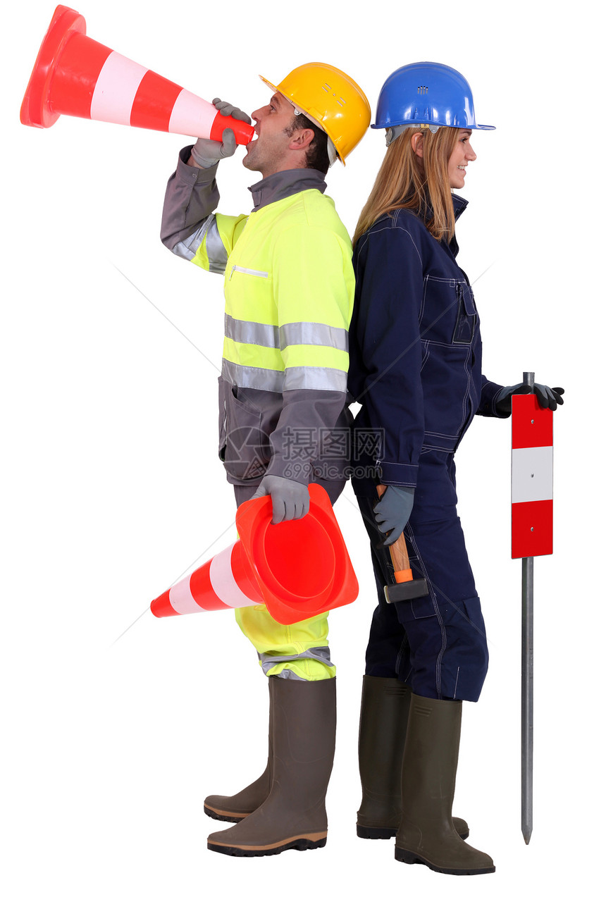 一对夫妇的公路工人帽子金发男性警告扩音器女孩裙子锤子工作男人图片